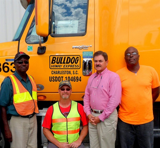 <p><strong>With Phil Byrd, president of Bulldog Hiway Express (second from right) are senior drivers (left to right), Robert Gibbs, Timothy Smith,and Gerald Waring.</strong> <em>Photo courtesy of Bulldog Hiway Express</em></p>