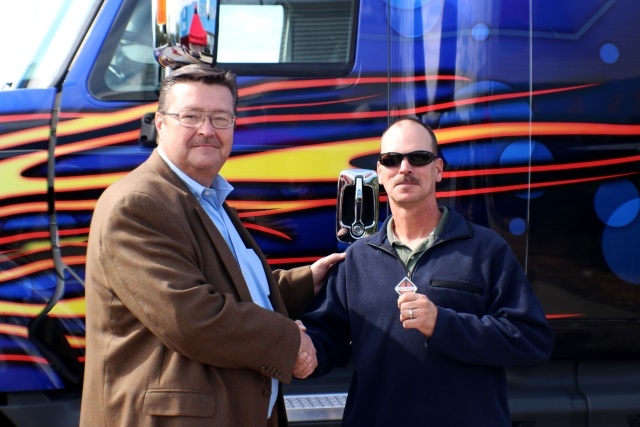 <p><em>Houston area driver Jim McCauley receives the keys to an International ProStar from Danny Thomas of Navistar as the winner of the OnCommand Connection Sweepstakes. (Photo courtesy of Navistar)</em></p>