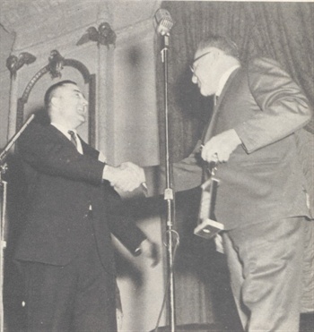 <p>Ed Bobit (left), publisher of Automotive Fleet, presents AF's Contribution Award to Sam Lee at the 1963 NAFA banquet.</p>